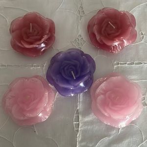 Set of 5 new floating rose wax candles. Individually wrapped.